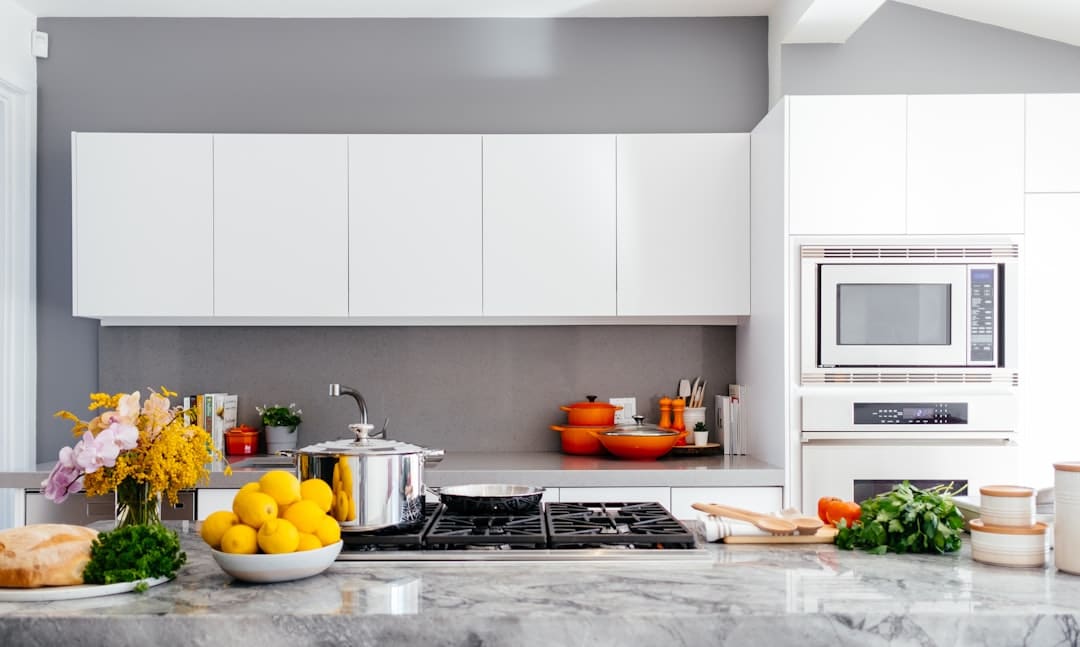 A tidy and well-lit kitchen, ready for potential buyers